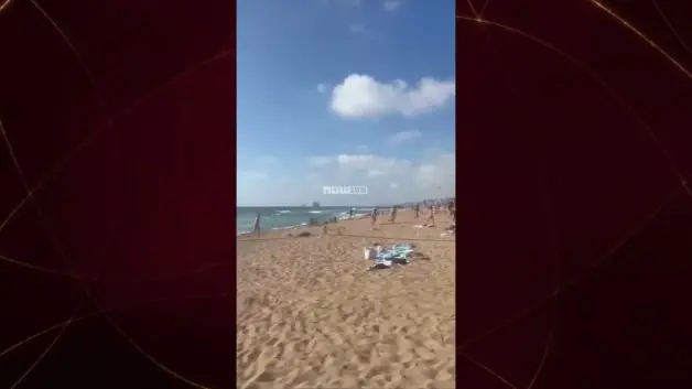 Hizbullah'ın attığı roketlerin denize düşmesi plajdaki İsraillilerde korkuya neden oldu